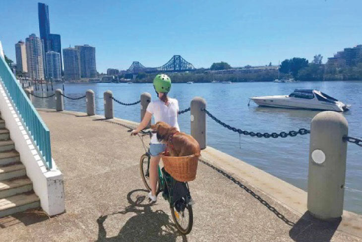 EBB Customer on Ebike with Pet Dog